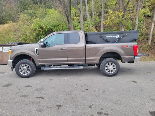 Heavy duty pickup with a salt spreader mounted in the bed